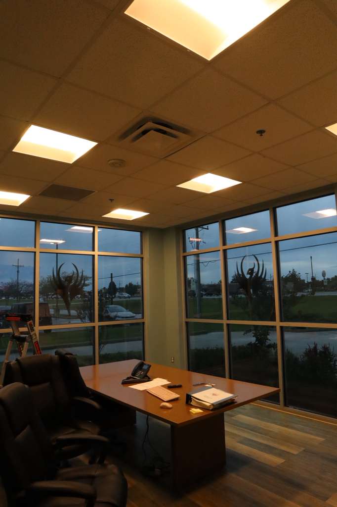 Executive office interior showing tinted window solar control
