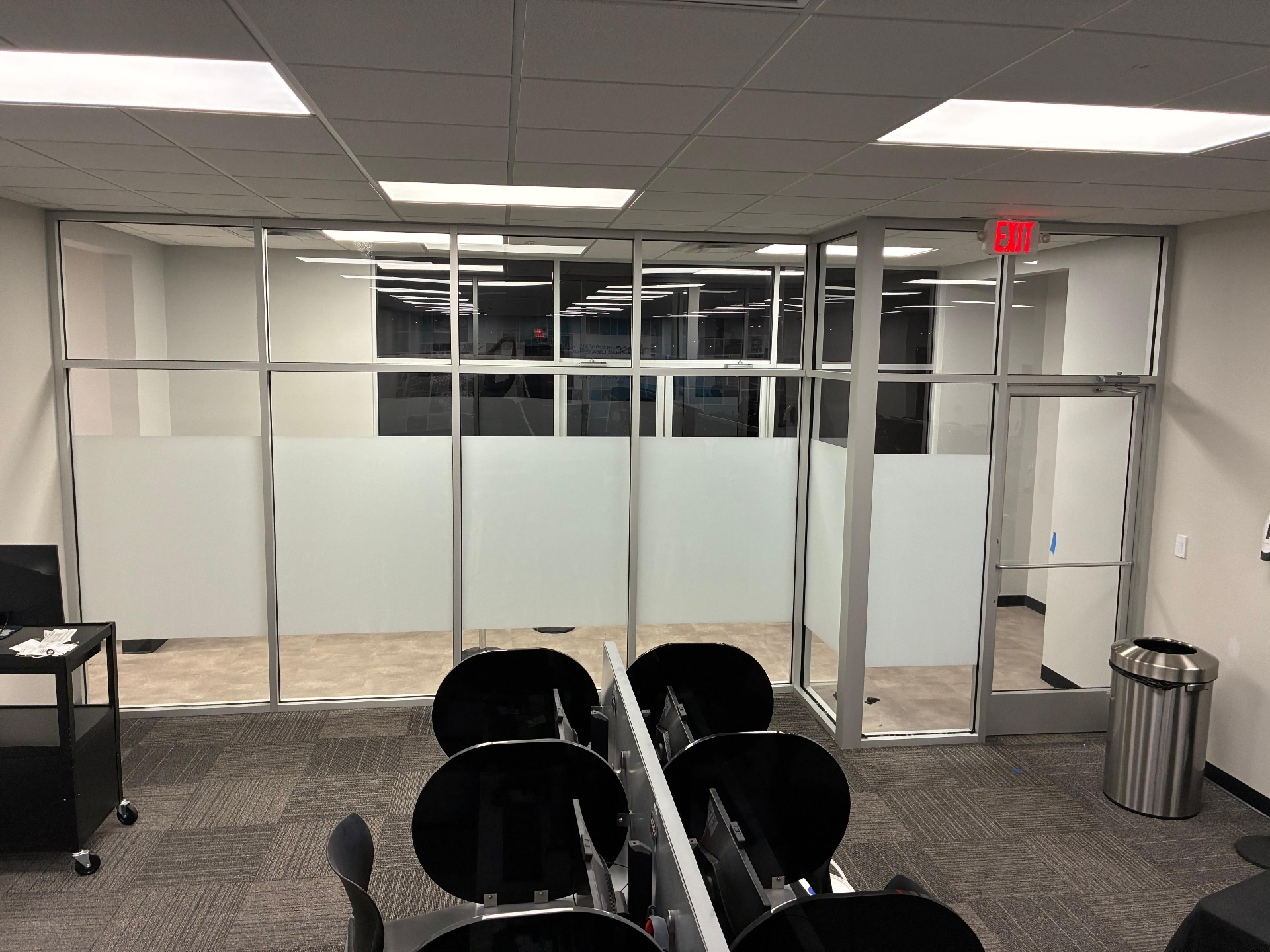 Conference room glass partitions with frosted gradient privacy film